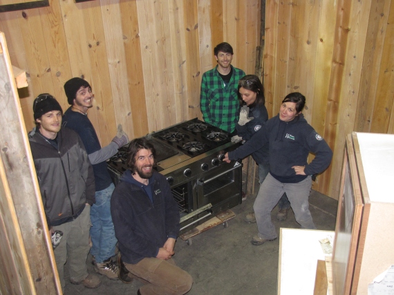The crew with a finished display area awaiting cabinets